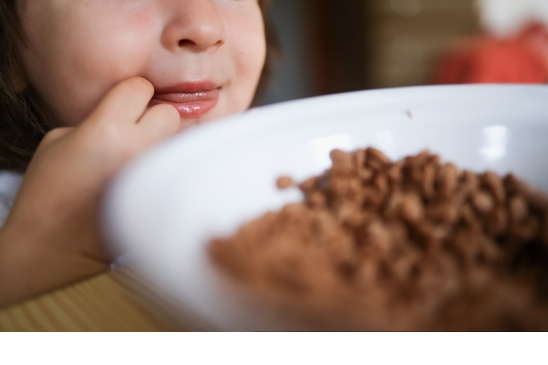 np A small kid eating healthy cereals in the morning. 4AGOrm free